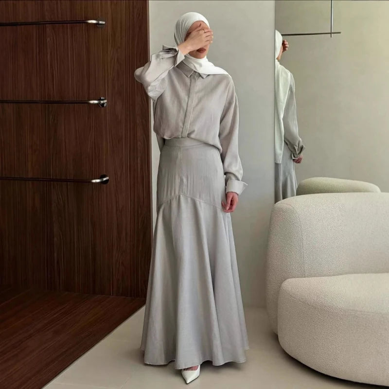 Close-up of turn-down collar and button detailing on grey modest two-piece dress set