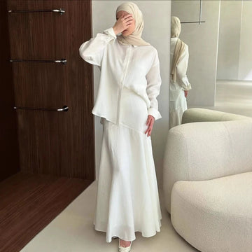 Front view of grey modest two-piece set showing button decoration and nine-quarter sleeves