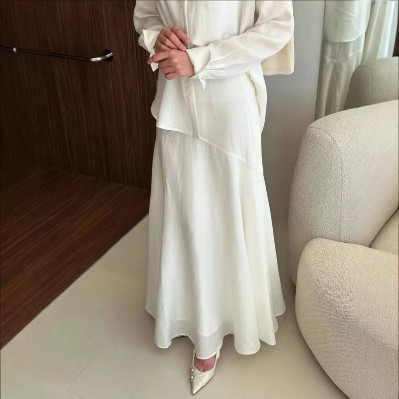 Side view of ankle-length A-line modest dress set in grey polyester fabric